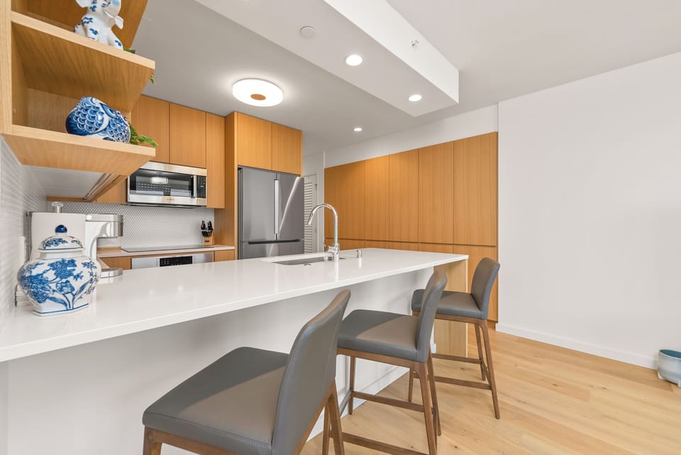 Enhance your dining experience with the kitchen island and barstool seating.