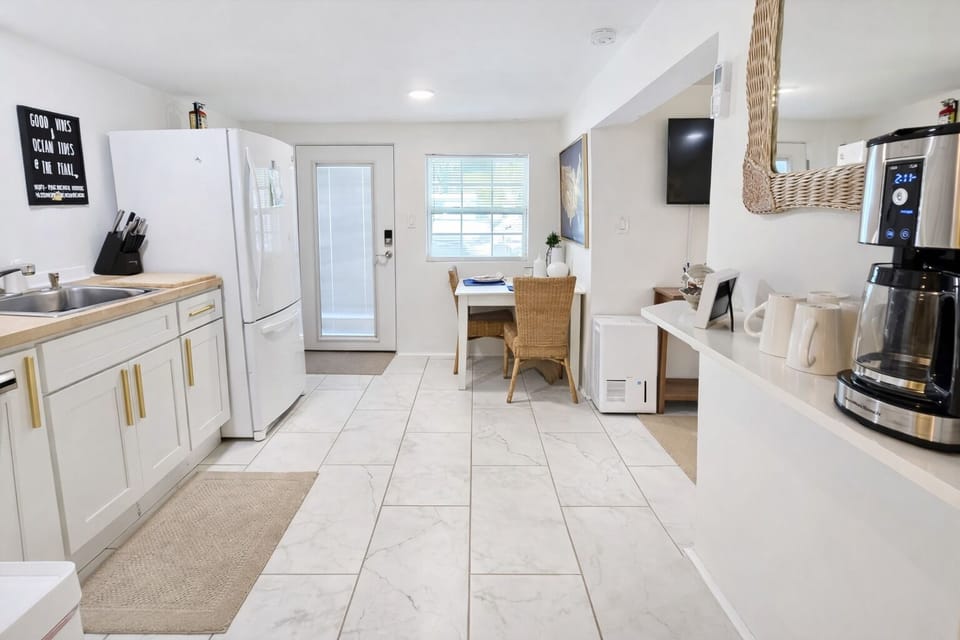 Kitchen looking into dining area and exit 