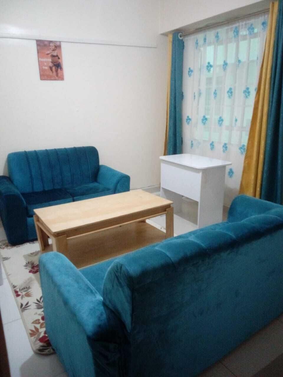Comfort Apartment, City View | Living area | 24-inch Smart TV with digital channels
