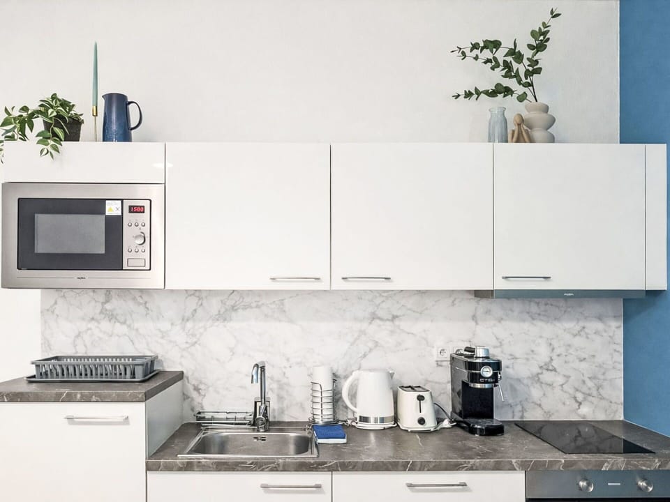 Kitchen, Kitchen Appliance, Countertop, Major Appliance, Cabinetry, Home Appliance, Furniture, Interior Design, Kitchen Stove, Home