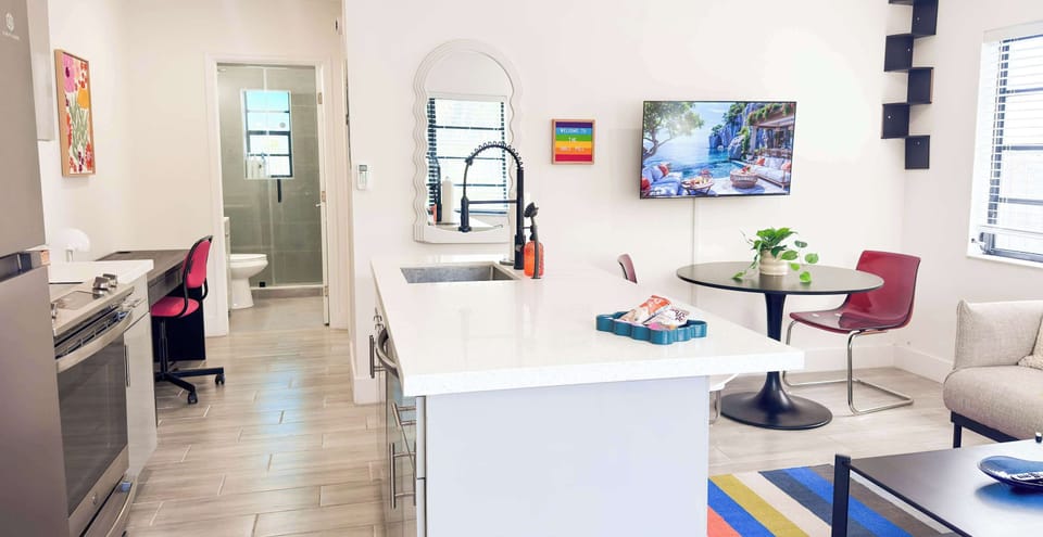 Cook while watching TV or chatting with friends in the living area.