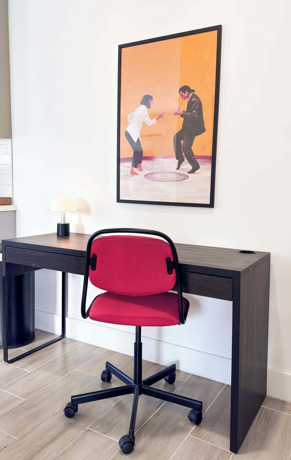 A comfortable desk space with a Pulp Fiction poster for a little creative inspiration while you work.