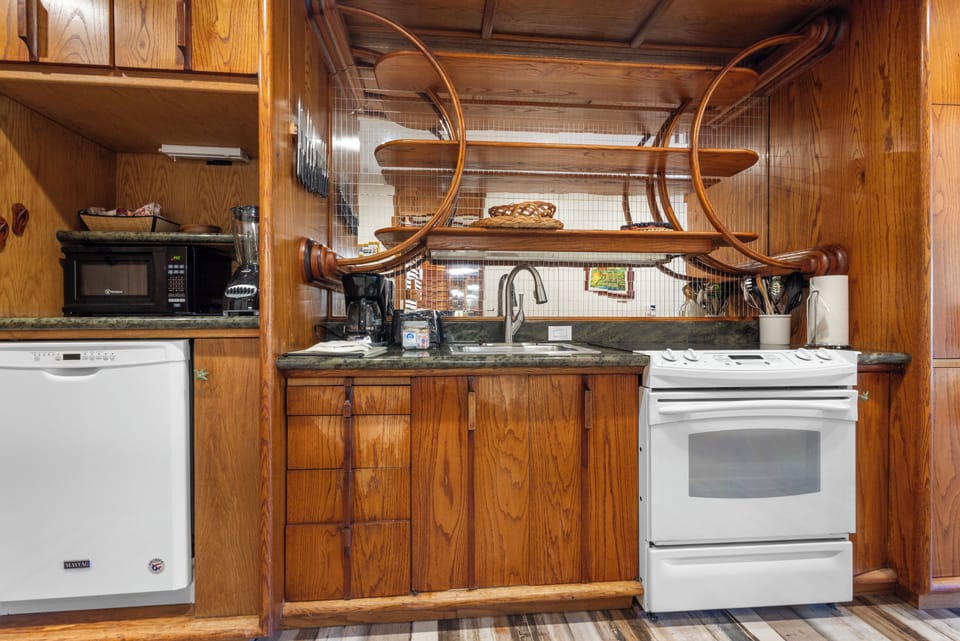 Your fully-equipped kitchen features warm wood cabinetry, modern appliances, and unique rustic touches—perfect for preparing meals during your stay.