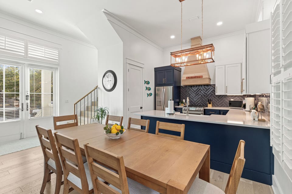 Gather around this beautiful dining table with loved ones while meals are prepared in your stylish, fully-equipped kitchen.