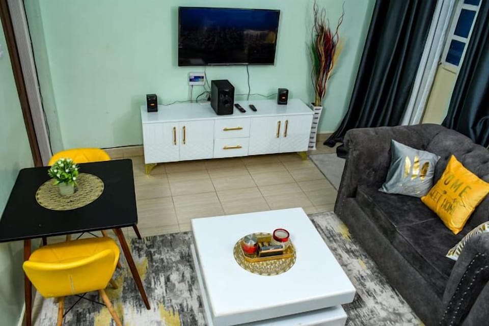 Deluxe Apartment, City View | Living area | 24-inch Smart TV with digital channels