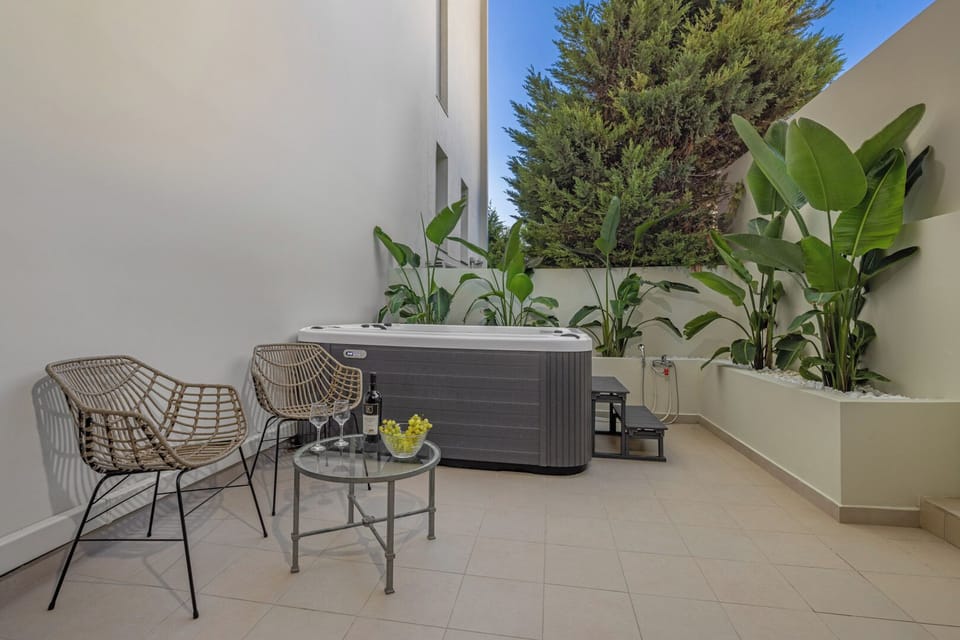 Backyard Jacuzzi Area with Sun Umbrella and Sun Bed
