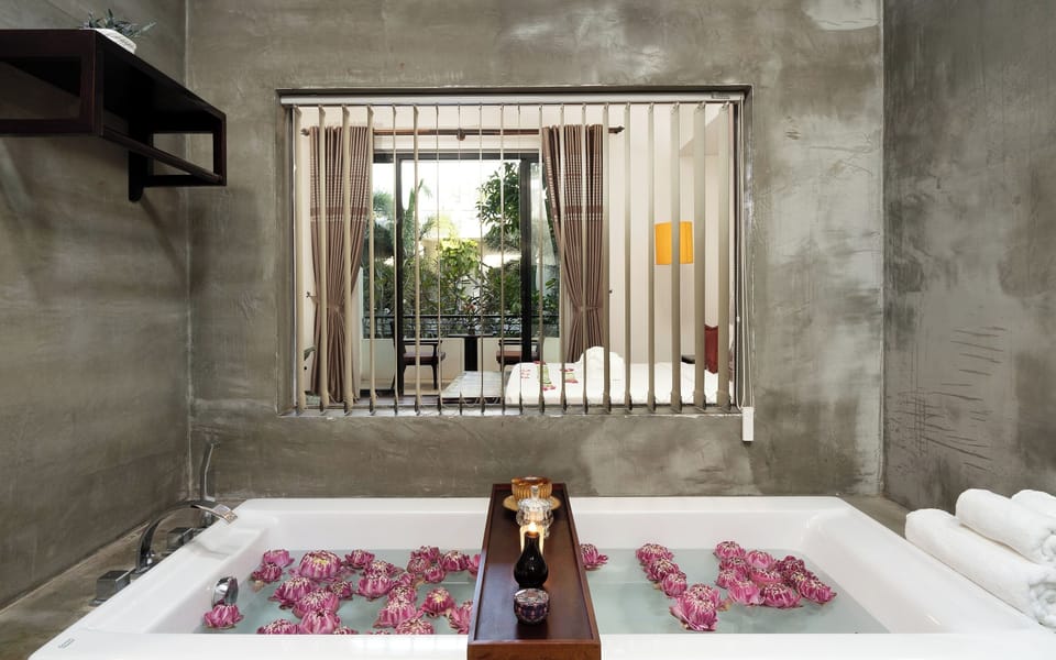 Designer toiletries, hair dryer, bathrobes, slippers