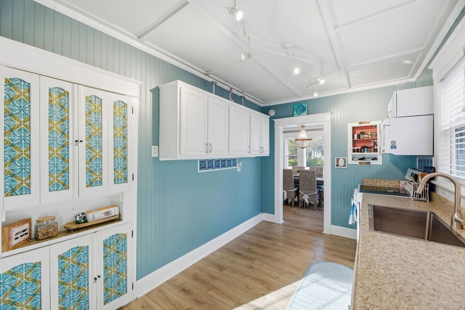 Bright coastal kitchen with beautiful cabinets