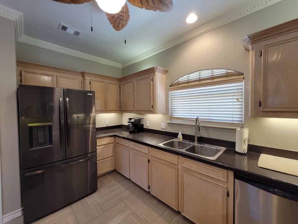 Kitchen has everything needed for cooking and dining 