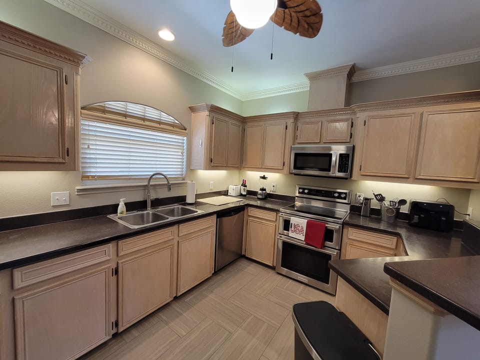 Kitchen has everything needed for cooking or dining