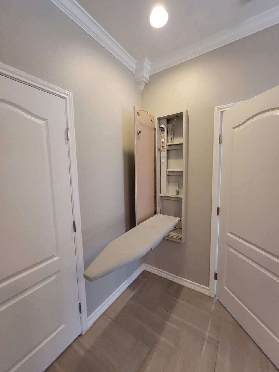 In wall ironing board in master bedroom