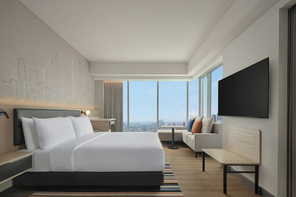 Panoramic Loft, 1 King Bed, Non Smoking, City View | Premium bedding, down comforters, minibar, in-room safe