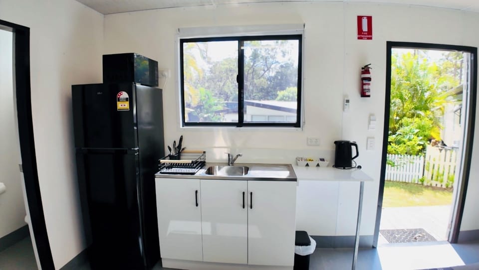 Apartment | Private kitchen | Fridge, microwave, stovetop, cookware/dishes/utensils