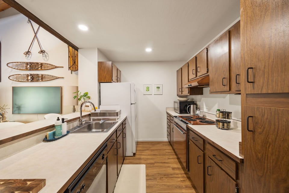 A galley kitchen offers ample prep space and kitchen amenities