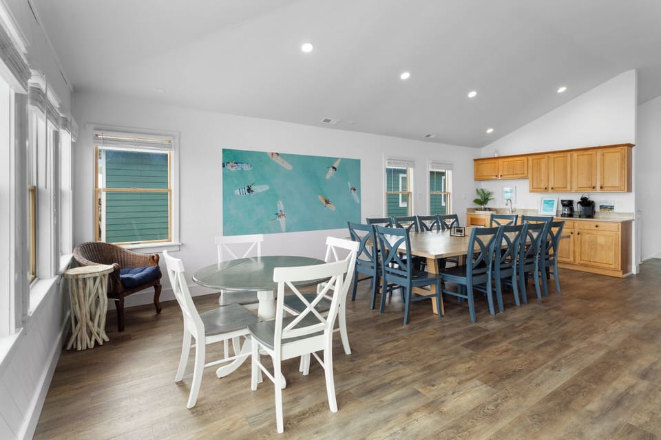 Eat in a large, well-lit Dining Area with an additional table for family meals and special moments.