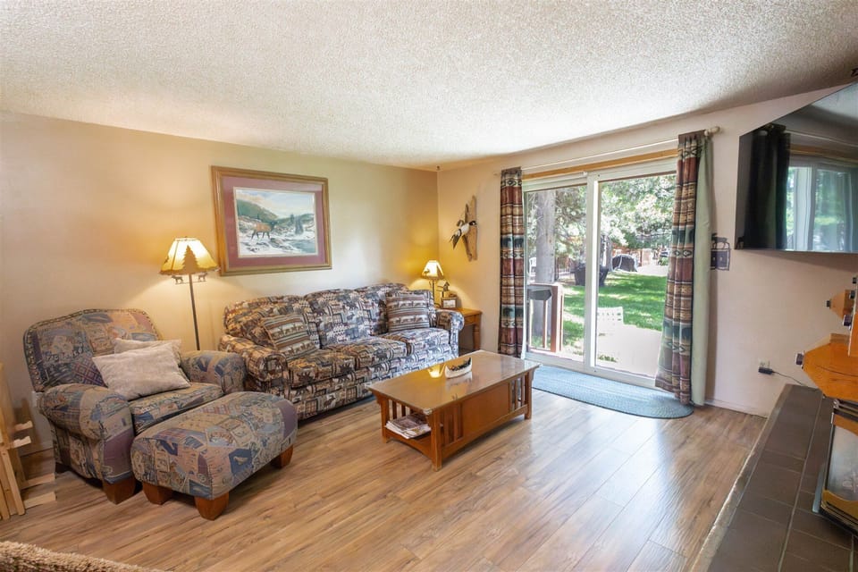 Living Room with sliding glass doors that lead to outside porch