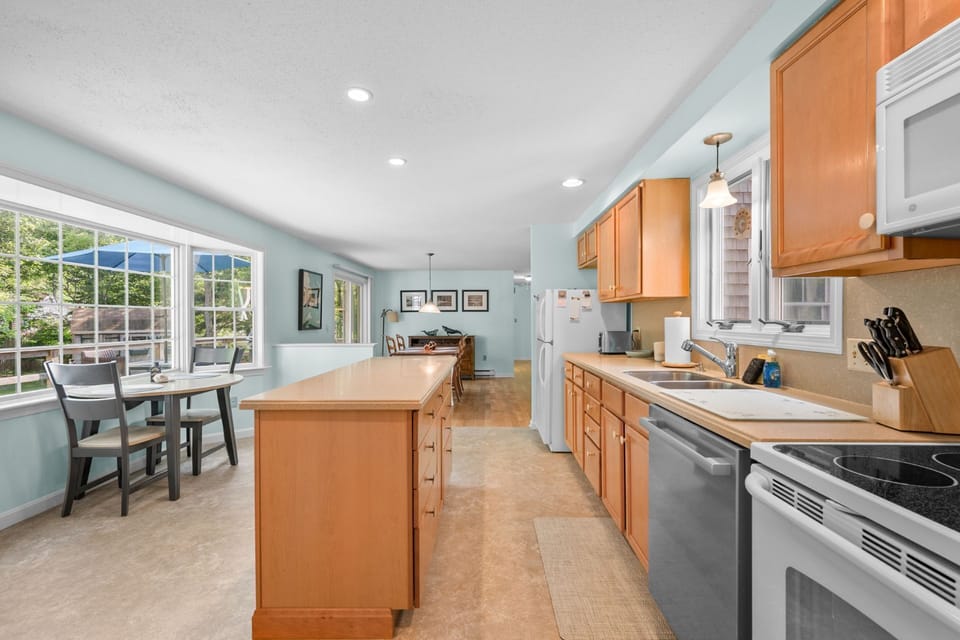 Fully equipped kitchen looking into the dining area
