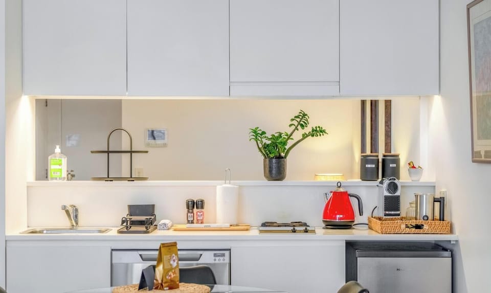 A modern and neat kitchen area with clean lines, perfect for daily use.