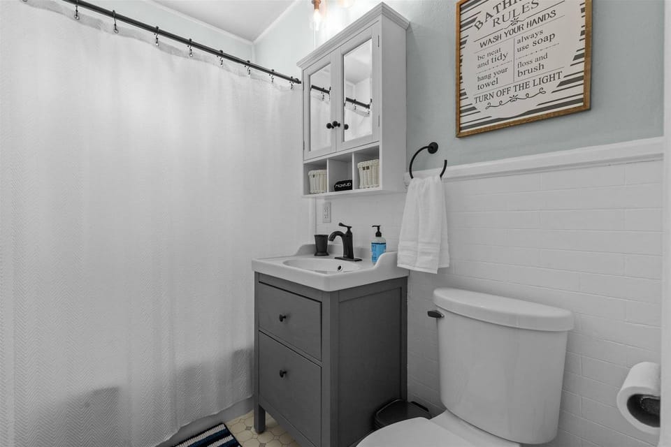 Guest Bathroom with shower, tub, toilet, and sink!