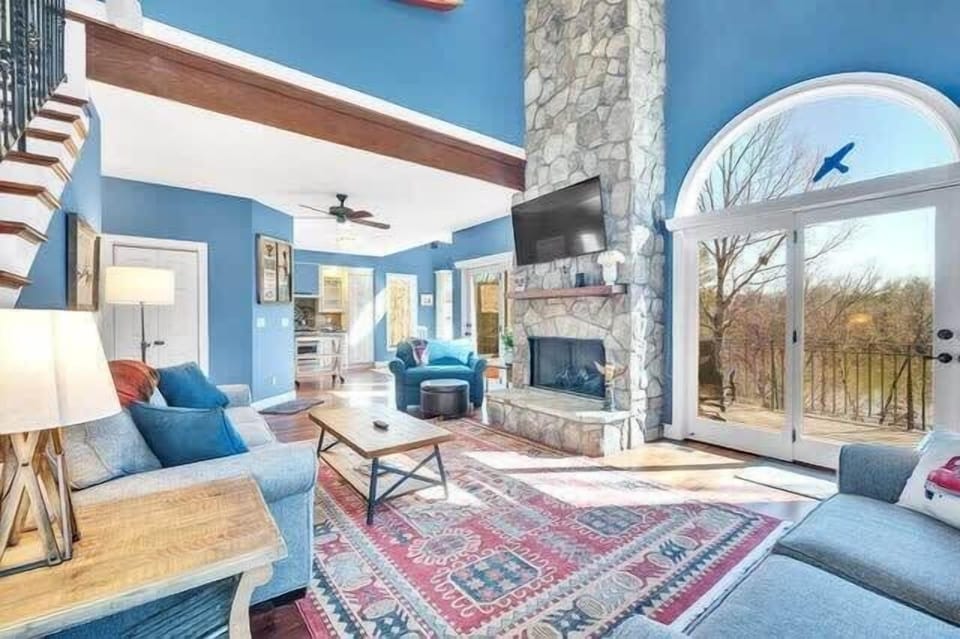 Relax and unwind in our comfy and spacious living area, where expansive windows frame breathtaking views and flood the space with natural light. 