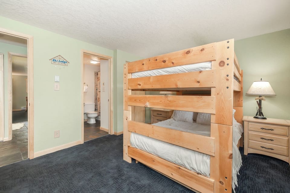 Your kids will love this cozy bedroom with sturdy wooden bunk beds, perfect for sharing adventures and bedtime stories together.