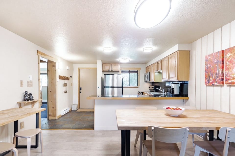 Your spacious kitchen and dining area features warm wood tones, modern appliances, and a bright open layout perfect for cooking and gathering.