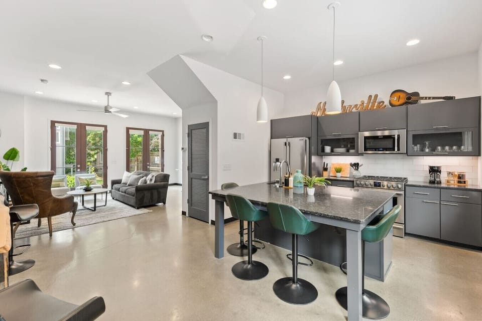 Beautiful light-filled open floor plan connecting the kitchen and living areas.