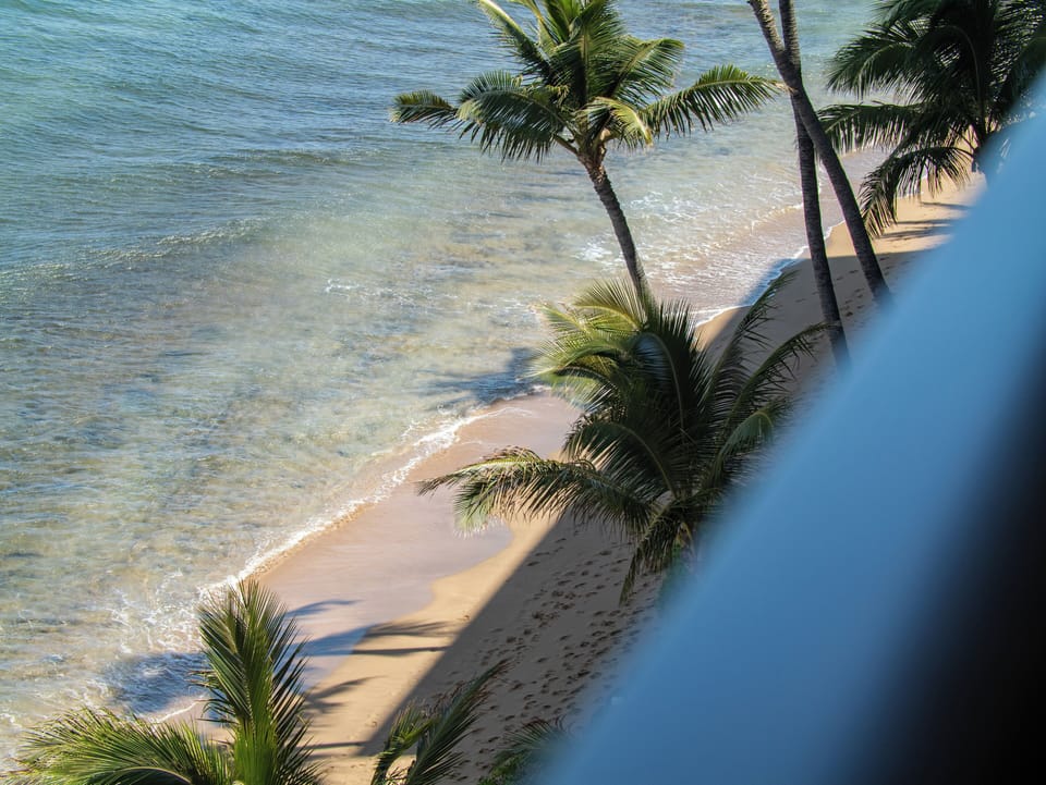Gaze down at the soft sands and clear water just outside your condo—ideal for swimming, snorkeling, or sunbathing on a peaceful Kaanapali coastline.