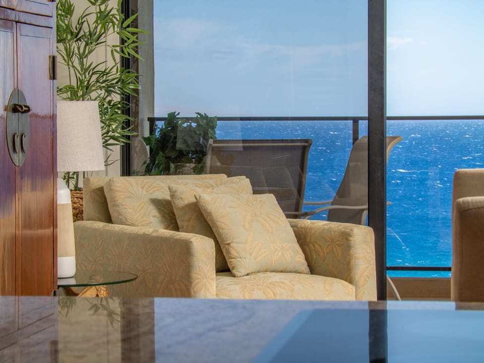 Curl up in this cozy chair with a good book and let the sound of the waves calm you in this perfectly placed nook with unobstructed ocean views.
 File Name: cozy-oceanview-reading-nook-maui-condo.jpg