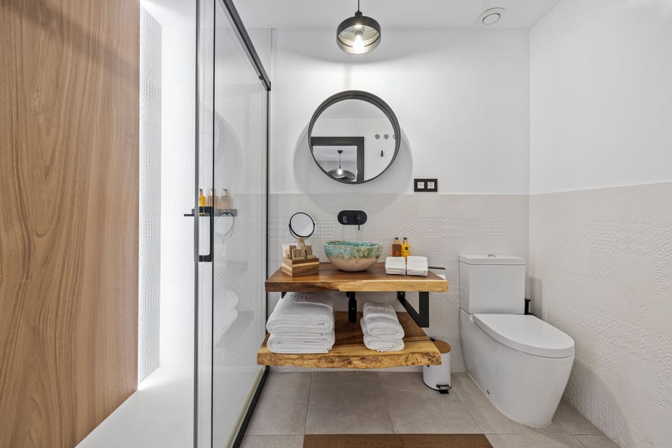 Shower, hair dryer, slippers, towels