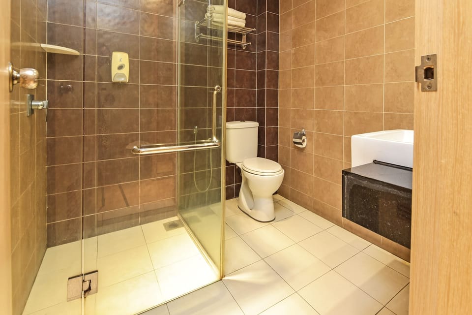 Shower, free toiletries, slippers, towels