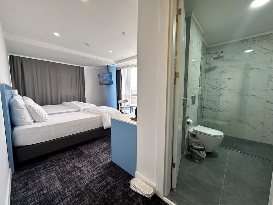 Family Triple Room, City View | Desk, laptop workspace, WiFi (free)