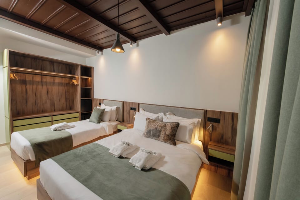 Standard Triple Room | Minibar, in-room safe, soundproofing, iron/ironing board