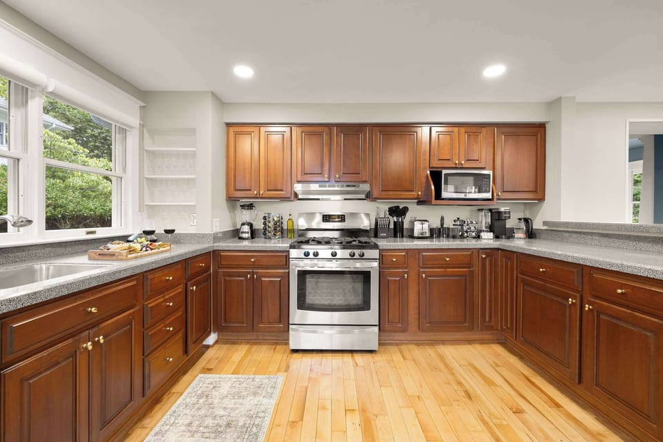 Bright & Functional Kitchen: Create delicious meals in a sunny, fully stocked kitchen with stainless steel appliances.