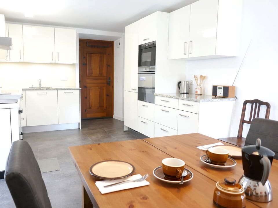 Furniture, Cabinetry, Flooring, Interior Design, Countertop, Kitchen, Floor, Kitchen Appliance, Wood, Ceiling