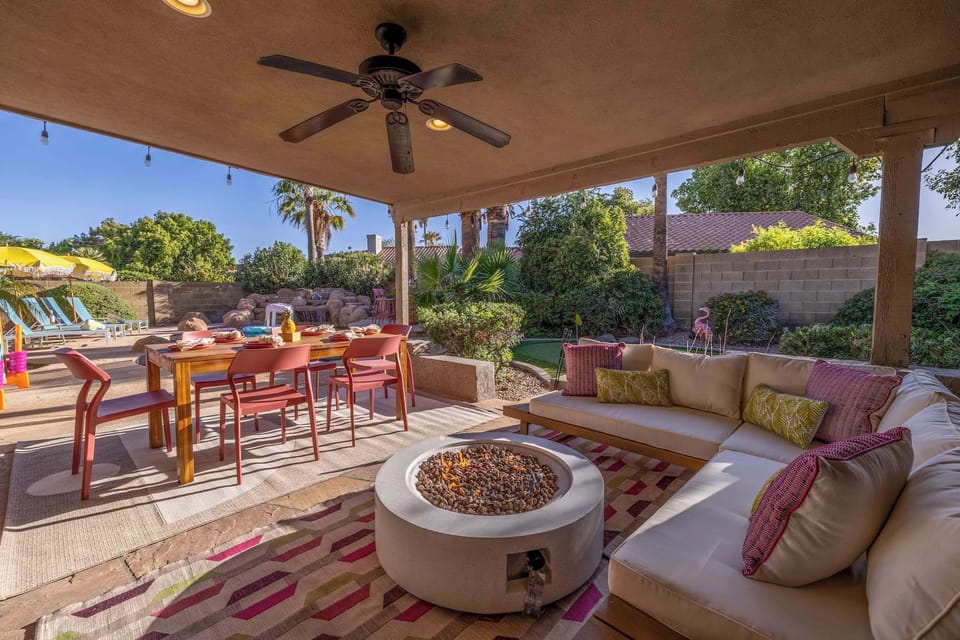 A cozy fire pit lounge, outdoor dining for eight, and vibrant garden views—this is where evenings stretch out and stories are shared. Whether it's breakfast in the shade or late-night laughs by the fire, this backyard is made for you.