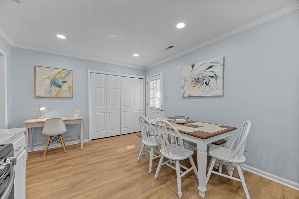Spacious kitchen with stainless appliances, dishwasher & table for six.