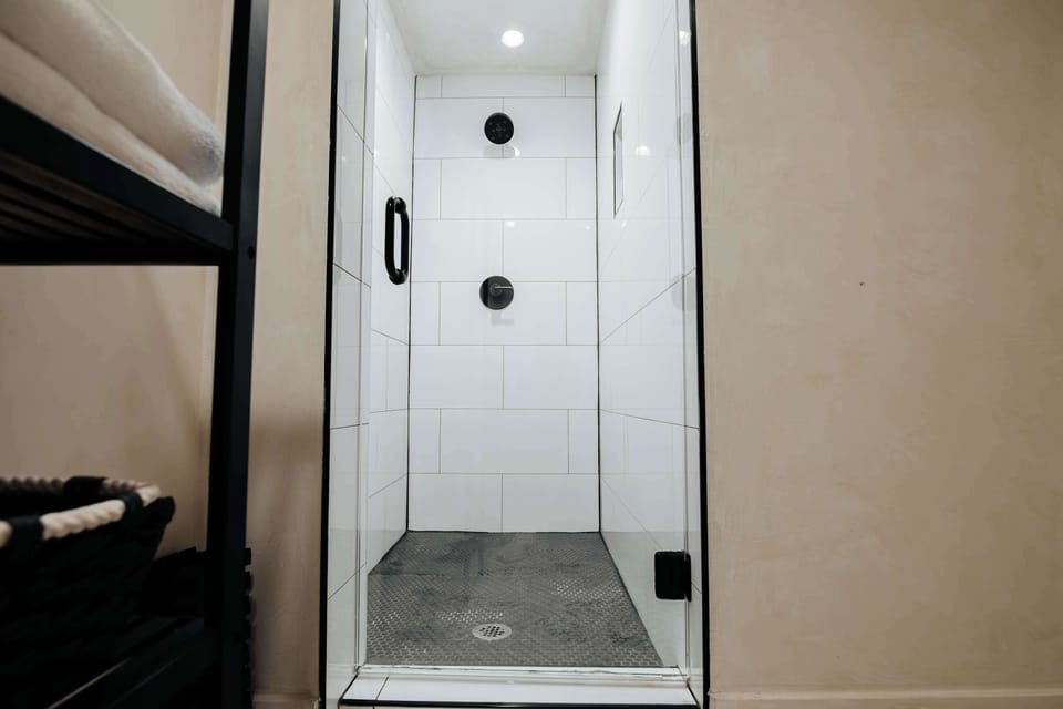 Full shower with hot water, body wash, shampoo and conditioner