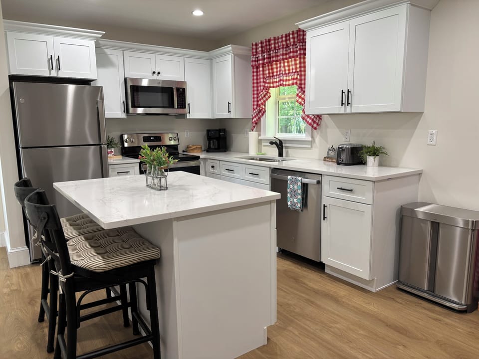 Full size kitchen with cookware, bakeware, serving dishes, and utensils.