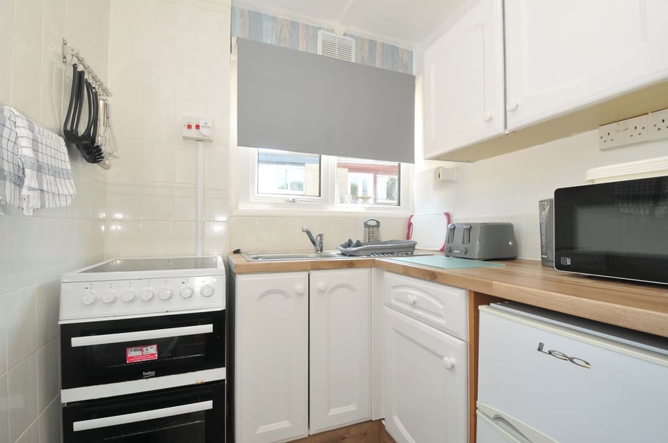Fridge, toaster, cookware/dishes/utensils
