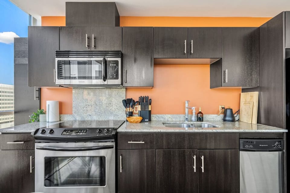 Full kitchen with a Drip & Keurig coffee maker, air fryer, crockpot and a kettle.