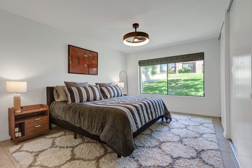 Master bedroom with King bed and bedside tables ready to charge devices.
