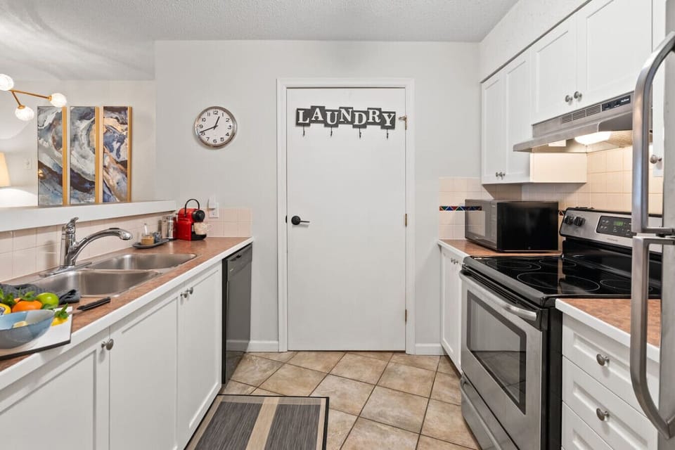 Direct kitchen access to the in-suite laundry room.