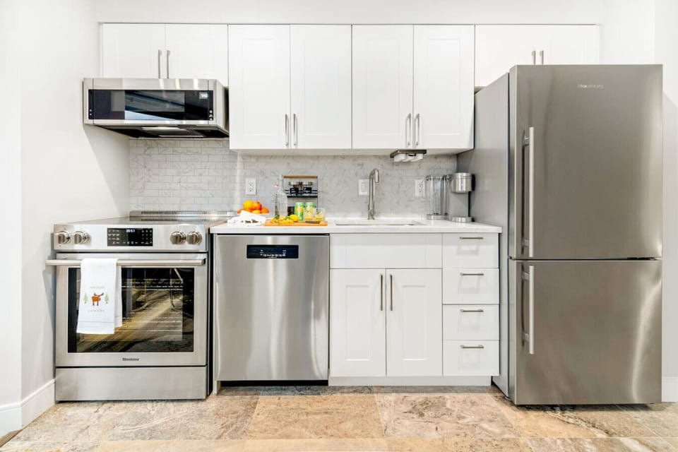 Well-equipped kitchen with coffee, tea, and convenient essentials.