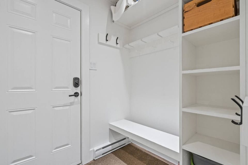 Entryway with convenient storage for skis, snowboards and boots.