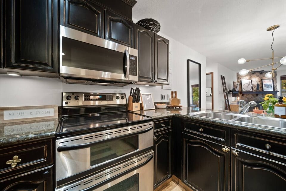 Stylish kitchen with stainless appliances and fully stocked cabinets ready for any meal.