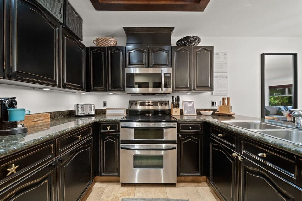 Stylish kitchen with modern appliances and rich cabinetry for easy meal prep.