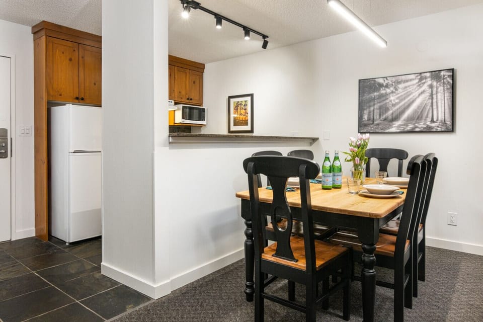 Dining area for six next to kitchen in a comfortable, open space
