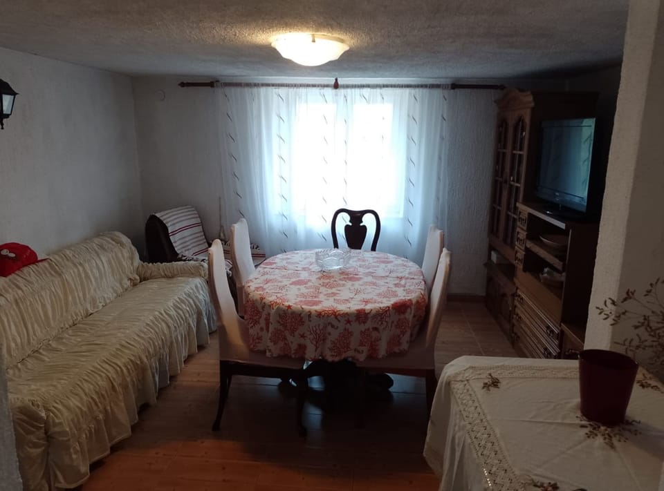 House (Two Bedroom Holiday Home) | Living room | 32-inch flat-screen TV with cable channels