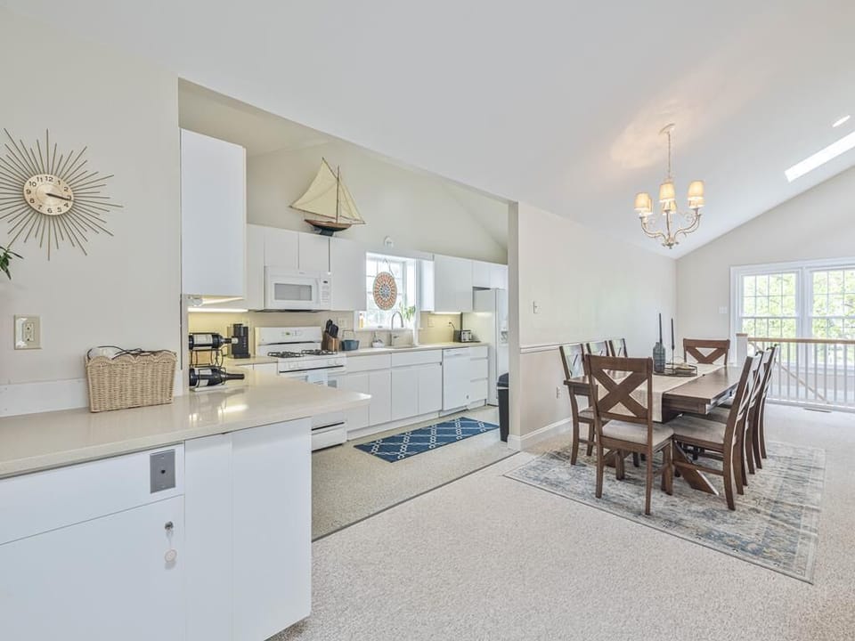 Fully equipped kitchen with modern appliances and dining room access—ideal for home-cooked meals and casual breakfasts.